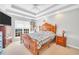 Bright bedroom featuring a wood-framed bed, a ceiling fan, and plenty of natural light at 8870 Dornoch Cir, Winston, GA 30187