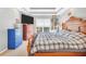 Bedroom with wood-framed bed, dresser, and window at 8870 Dornoch Cir, Winston, GA 30187
