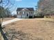Well-maintained two-story home with a two-car garage and large front yard at 8870 Dornoch Cir, Winston, GA 30187