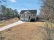 Well-maintained two-story home with a spacious front yard and an attached garage at 8870 Dornoch Cir, Winston, GA 30187
