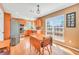 Eat-in kitchen with stainless steel appliances, wood cabinets, and natural light at 8870 Dornoch Cir, Winston, GA 30187