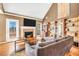 Cozy living room featuring a fireplace, hardwood floors, and natural light, great for relaxing at 8870 Dornoch Cir, Winston, GA 30187