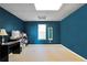 Bright office featuring a sleek desk setup, a window with blinds and storage space at 8870 Dornoch Cir, Winston, GA 30187