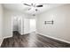 Spacious bedroom with wood-look floors, a closet, and two doors leading to other rooms at 1250 Parkwood Circle Se # 1110, Atlanta, GA 30339