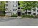 Multi-story building with a well-maintained exterior and manicured landscaping at 1250 Parkwood Circle Se # 1110, Atlanta, GA 30339