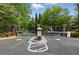 Gated community entrance with manicured landscaping at 1250 Parkwood Circle Se # 1110, Atlanta, GA 30339