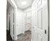 Hallway showcasing neutral paint, luxury vinyl plank flooring and multiple doorways at 1250 Parkwood Circle Se # 1110, Atlanta, GA 30339