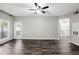 Spacious living room with luxury vinyl plank flooring, ceiling fan, and natural light at 1250 Parkwood Circle Se # 1110, Atlanta, GA 30339