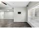 Living room with luxury vinyl plank flooring, modern ceiling fan, and large bright windows at 1250 Parkwood Circle Se # 1110, Atlanta, GA 30339