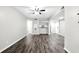 Open-concept living room with luxury vinyl plank flooring and view into the kitchen at 1250 Parkwood Circle Se # 1110, Atlanta, GA 30339