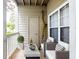 Cozy patio area with outdoor seating and a small table with decor at 1250 Parkwood Circle Se # 1110, Atlanta, GA 30339