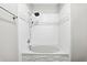 Shower and tub featuring white subway tile and stone accents at 1250 Parkwood Circle Se # 1110, Atlanta, GA 30339