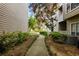 Picturesque walkway through the apartment community, lined with landscaping at 1250 Parkwood Circle Se # 1110, Atlanta, GA 30339