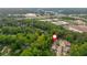An aerial view shows the home's proximity to highways, businesses, and ample green space at 2918 Arbor Creek Ln, Atlanta, GA 30340