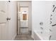 Bright bathroom featuring gray tile floors and a shower/tub combo at 2918 Arbor Creek Ln, Atlanta, GA 30340