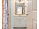 Bathroom featuring a white vanity and framed mirror at 2918 Arbor Creek Ln, Atlanta, GA 30340