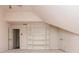 Upstairs bonus room featuring carpet and built-in shelves at 2918 Arbor Creek Ln, Atlanta, GA 30340