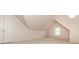 Upstairs bonus room with vaulted ceiling and natural light at 2918 Arbor Creek Ln, Atlanta, GA 30340