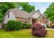 Well-maintained home boasts a brick exterior, lush greenery, and a manicured lawn at 2918 Arbor Creek Ln, Atlanta, GA 30340