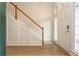 Bright foyer with staircase, white trim, and wood-look floors at 2918 Arbor Creek Ln, Atlanta, GA 30340