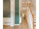 Bright foyer featuring wood floors, staircase, and views to the home's interior at 2918 Arbor Creek Ln, Atlanta, GA 30340