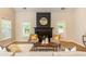 Bright living room featuring a black fireplace, light hardwood floors, and neutral color palette at 2918 Arbor Creek Ln, Atlanta, GA 30340