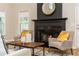Cozy living room featuring a fireplace and comfortable armchairs at 2918 Arbor Creek Ln, Atlanta, GA 30340