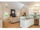 Open-concept living space with modern furnishings and a view into the kitchen area at 2918 Arbor Creek Ln, Atlanta, GA 30340