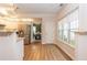 Open concept living space showcasing a modern kitchen and view of the dining room at 2918 Arbor Creek Ln, Atlanta, GA 30340