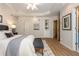 Inviting main bedroom with a tray ceiling and access to ensuite bathroom at 2918 Arbor Creek Ln, Atlanta, GA 30340