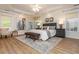 Spacious main bedroom featuring tray ceiling, wood floors, and ample natural light at 2918 Arbor Creek Ln, Atlanta, GA 30340