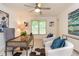 Bright office featuring a ceiling fan, cozy seating, and large window at 2918 Arbor Creek Ln, Atlanta, GA 30340