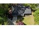 Aerial view of the home showing mature trees, landscape, and the surrounding neighborhood at 343 Ridge Pine Dr, Canton, GA 30114