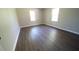 Comfortable bedroom featuring new floors, neutral paint, and natural light from two windows at 343 Ridge Pine Dr, Canton, GA 30114
