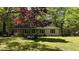 Charming home with a well-manicured front yard and lush greenery at 343 Ridge Pine Dr, Canton, GA 30114
