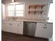 Kitchen featuring white cabinets and stainless steel dishwasher at 343 Ridge Pine Dr, Canton, GA 30114