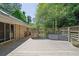 Spacious back deck with wooden floor, partial fencing, and outdoor seating for enjoying outdoor living at 3563 Castleridge Dr, Tucker, GA 30084