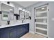 Modern bathroom with double sinks, stylish cabinetry, and chic sliding glass door at 3563 Castleridge Dr, Tucker, GA 30084