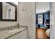Bright bathroom featuring a marble countertop, modern mirror, and sleek design at 3563 Castleridge Dr, Tucker, GA 30084