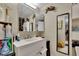 Bright bathroom features a large mirror, single vanity, and shower/tub combo at 3563 Castleridge Dr, Tucker, GA 30084