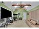 Bright bonus room with skylights, ceiling fan, and a comfortable seating area at 3563 Castleridge Dr, Tucker, GA 30084