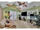 Bright bonus room with skylights, ceiling fan, and a comfortable seating area at 3563 Castleridge Dr, Tucker, GA 30084
