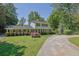 Attractive two-story home featuring a circular driveway and beautiful landscaping, providing great curb appeal at 3563 Castleridge Dr, Tucker, GA 30084