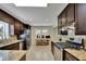 Kitchen with stainless steel appliances, dark brown cabinets, and granite countertops at 3563 Castleridge Dr, Tucker, GA 30084