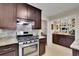 The renovated kitchen features granite countertops, stainless steel appliances, and a stylish backsplash at 3563 Castleridge Dr, Tucker, GA 30084