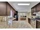 Spacious kitchen featuring granite countertops, stainless steel appliances, and dark wood cabinetry at 3563 Castleridge Dr, Tucker, GA 30084