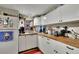 Efficient kitchen with butcher block counters, white cabinets, and ample natural light at 3563 Castleridge Dr, Tucker, GA 30084