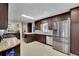 Kitchen with stainless steel appliances, dark brown cabinets, and granite countertops at 3563 Castleridge Dr, Tucker, GA 30084