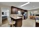View of the kitchen with granite countertops, stainless steel appliances, and breakfast bar seating at 3563 Castleridge Dr, Tucker, GA 30084