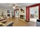 Bright living room with hardwood floors, ceiling fan, and cozy fireplace at 3563 Castleridge Dr, Tucker, GA 30084